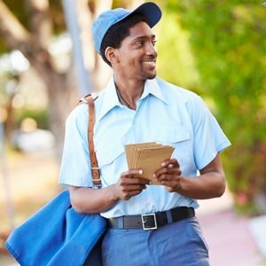 Postal employee delivering mail